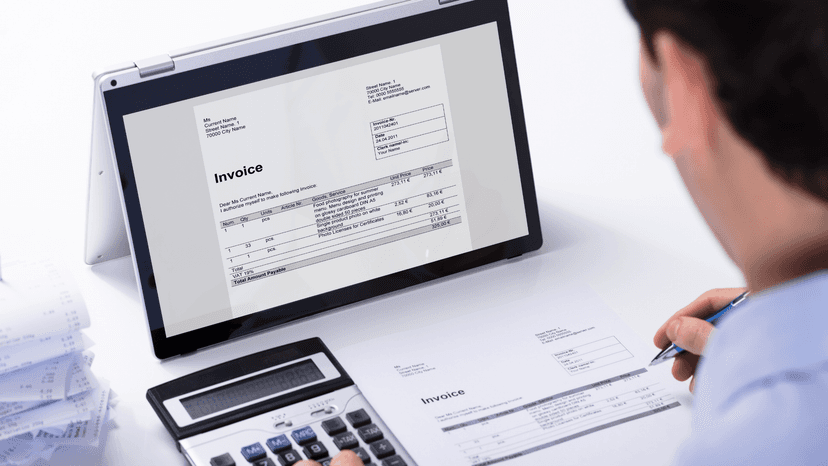 man reviewing invoices