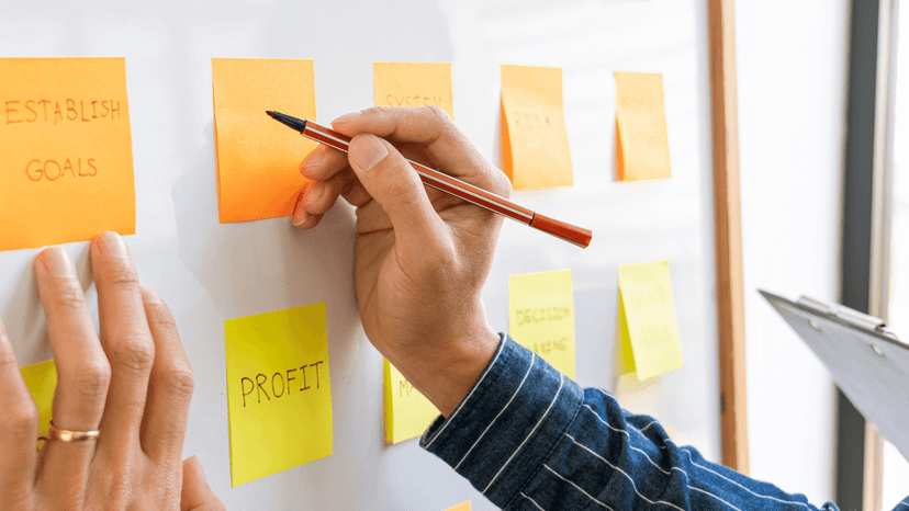 Hand writing on business planning board