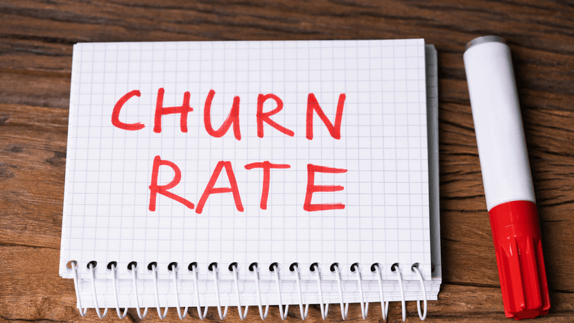 "Churn Rate" on note book and marker