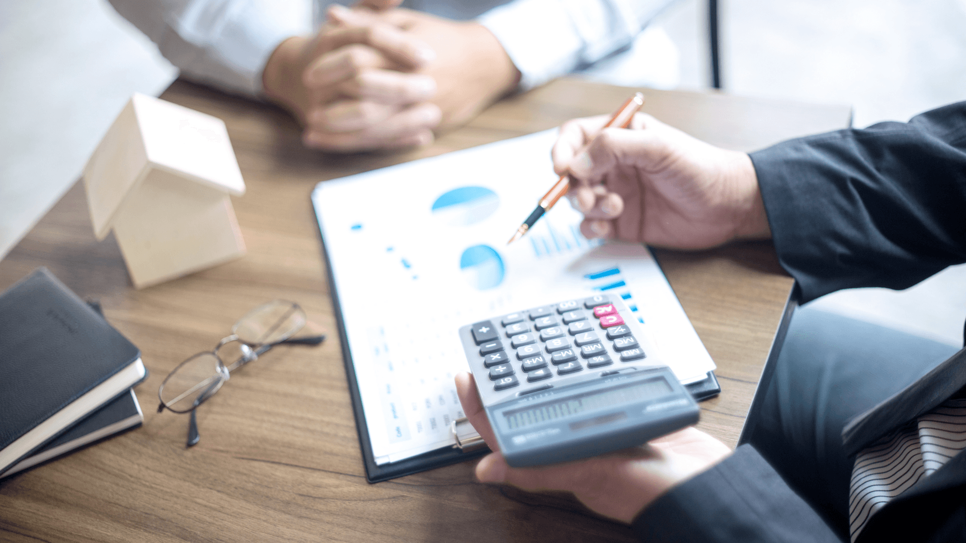 One business person explaining charts to another business person