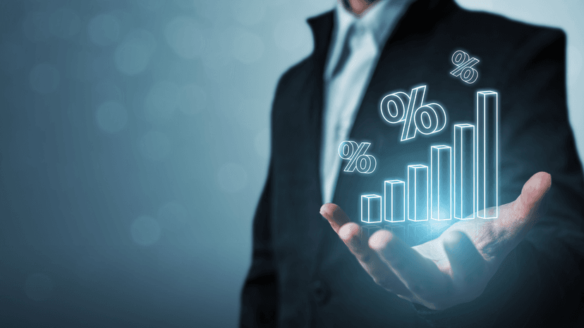 man in suit holding digital chart of increasing percentage