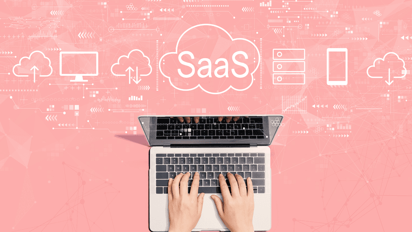hands on laptop with floating SaaS graphics