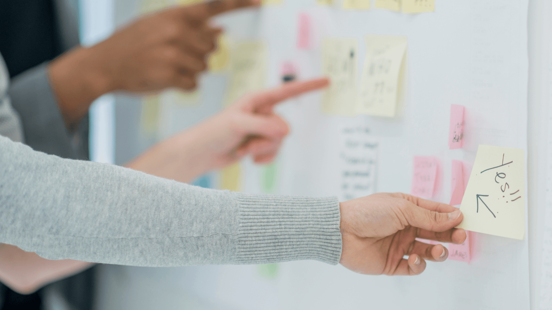 3 hands mapping a plan