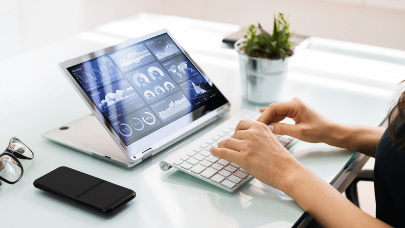 woman's hands working at the key board working on laptop