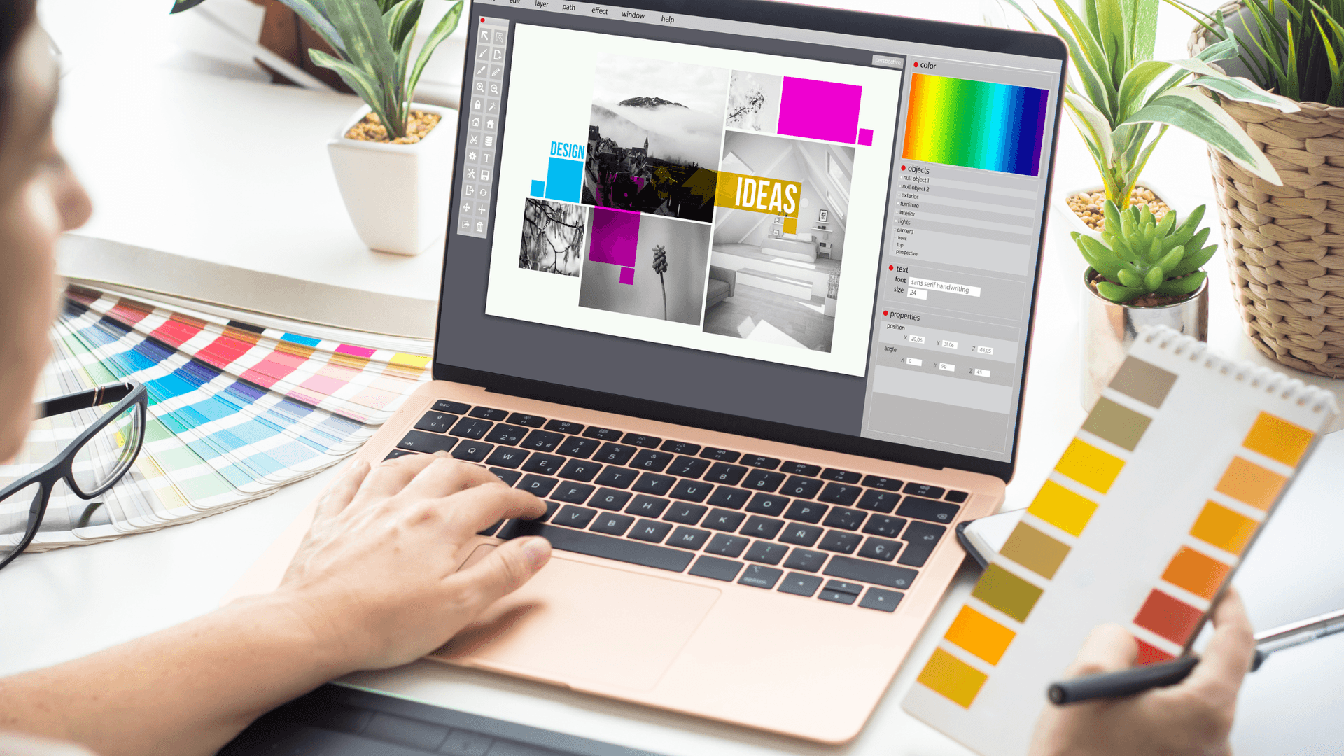 laptop used to create branding mood boad hands holding color swatches