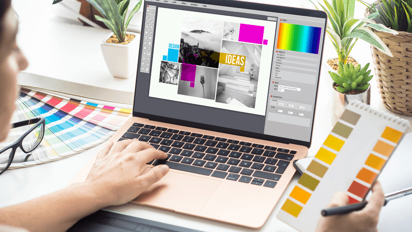 laptop used to create branding mood boad hands holding color swatches
