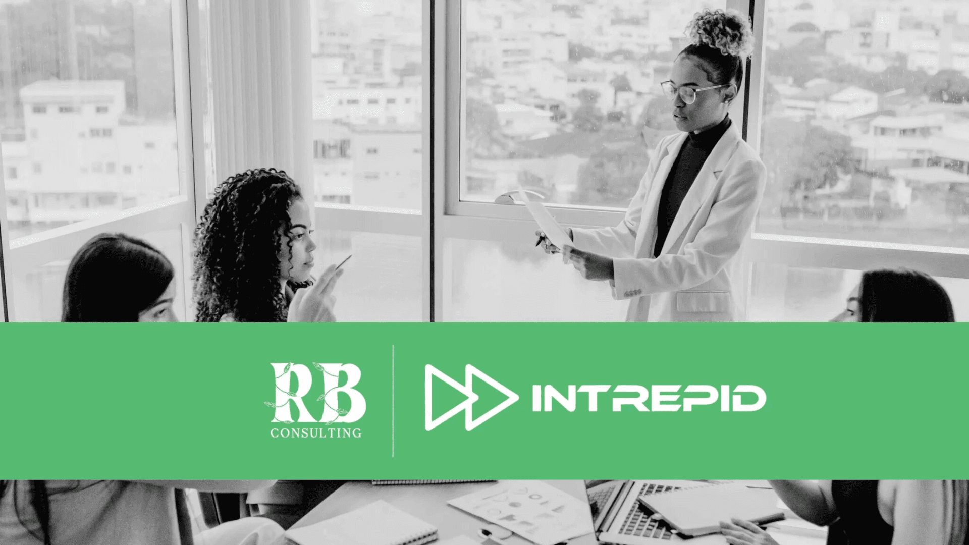 Businesswoman presenting a scalable sales strategy to team members in a modern office, representing collaboration between RB Consulting and Intrepid Finance.