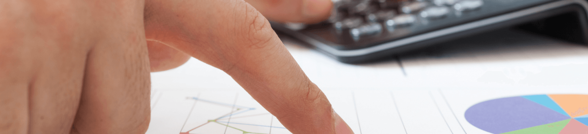 image of hands pointing at charts